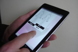 carer using bodymap function on a tablet